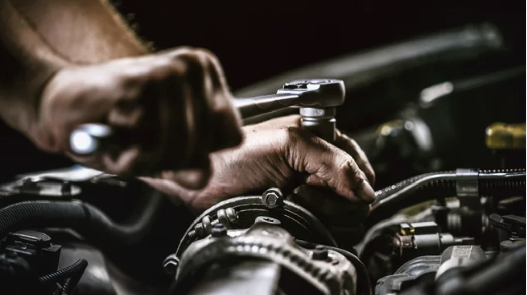 Premium sports car in a professional garage — showcasing precision mechanical workmanship